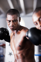 Image showing Fight, black man and boxer with hit in ring together for fitness, power strike and training challenge. Strong body, punch in face and fearless athlete in gym with action and confidence in competition