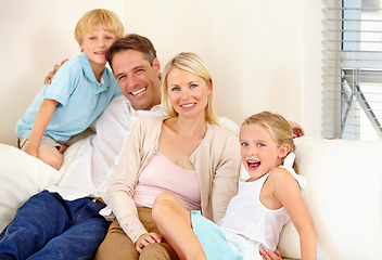 Image showing Family, portrait and happy on sofa with relax, peace and love for bonding and relationship in living room. Parents, kids and face with smile on couch of lounge with care, break and enjoyment in home