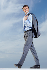 Image showing Businessman, walk and smile in happiness with suit for ambition, vision or idea for future growth. Corporate, male manager and consultant with jacket over shoulder for cool, trendy and confident pose