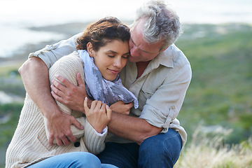 Image showing Couple, face and smile outdoor with hug for romance, love and relationship in nature with relaxing. Mature, man and woman or embrace with happy, peace and comfort for bonding, honeymoon and support