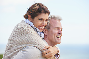 Image showing Mature couple, happy and piggy back on vacation, love and affection for holiday fun. Man, woman and bonding together with smile, marriage and commitment for travelling, care and relationship