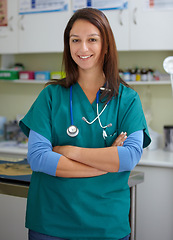 Image showing Happy woman, portrait and veterinarian professional at clinic for animal care, shelter or healthcare service. Female person, nurse or medical pet surgeon smile with arms crossed in confidence at vet