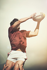 Image showing Rugby, sports and jump and man on field for athlete, health and stadium practice. Challenge, competition and performance with male person in outdoor pitch for exercise, games and workout