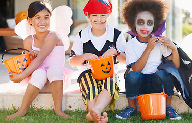 Image showing Children, halloween and candy bucket for costume fun or dracula dress up, fairy or pirate role play. Friends, group and pumpkin basket as dessert or trick or treat celebration, fantasy or development