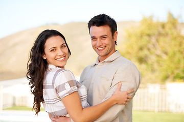 Image showing Couple, happy and portrait with hug and garden with joy, smiling and young people. Marriage, outdoor and love for commitment, bonding together and care for romantic relationship, man and woman