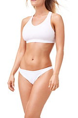 Image showing Health, fitness and body of woman in underwear for wellness, skincare and diet in studio. Confidence, stomach and isolated person in lingerie for cosmetics, lose weight and beauty on white background