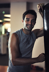 Image showing Portrait, smile and man boxing in the gym for strength, health and wellness. Happiness, punching bag and male athlete person with sportswear and sweat for confidence and healthy workout