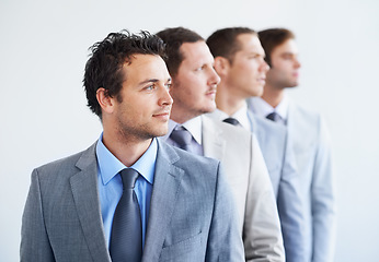 Image showing Men, thinking and serious for job interview, hiring selection and ready for finance career. Worker, corporate accountant in suit and professional in workplace, people in background and confident