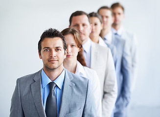 Image showing Man, portrait and happy for future finance career, standing and ready for job interview. Worker, corporate accountant in suit and professional in workplace, people in background and confident