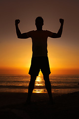 Image showing Silhouette, man and flex with sunset for winner, health and wellness on beach with sunrise and zen. Person, shadow and pilates or celebration for victory, mindfulness and healthy body by ocean or sea