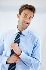 Image showing Businessman, portrait and happy in office for career, professional and employee at corporate job. Entrepreneur, face and person for smile, confidence and pride with calm expression or hands at work