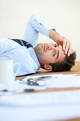 Image showing Business man, stress and headache or mental health, floor and exhausted or burnout, paperwork and overwhelmed. Male person, migraine and tired or frustrated, rest and fatigue for mistake and fail