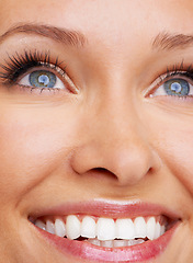 Image showing Woman, eyes and closeup with smile, teeth and vision with iris. Zoom, joy and happiness of a natural female model for optometry, future and positive emotion and cosmetics with lash extensions