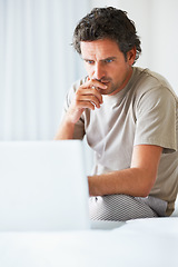 Image showing Thinking, man in bedroom and laptop for work from home, serious and sitting in bed for freelance idea. Technology, entrepreneur and remote worker for online job, company and marketing projects