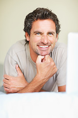 Image showing Portrait, man in bedroom and laptop to work from home, smiling and sitting in bed for freelance job. Technology, Entrepreneur and remote worker for online job, company and marketing projects
