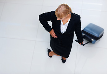 Image showing Travel, top view airport and business woman waiting for plane departure, holiday transportation or international flight trip. Lobby, airplane suitcase and corporate agent journey on hotel ground