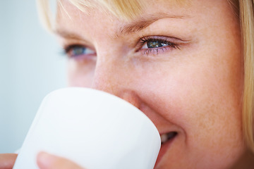 Image showing Smile, coffee and young woman at her home relaxing on a weekend morning for calm mindset. Happy, mug and female person from Australia drinking cappuccino, latte or tea with positive attitude at house