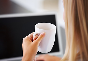 Image showing Rear view, woman and coffee with laptop and screen for research, planning and business project in office. Entrepreneur, person and cup for tea, espresso or cappuccino with technology at workplace