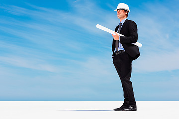 Image showing Engineer with helmet, blueprint and thinking with blue sky, mock up or project management. Architecture, construction space and business man with building planning, design idea and contractor on site