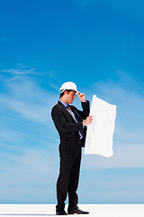 Image showing Industry, blueprint and man construction worker by blue sky on building rooftop for planning. Engineering, mockup space and professional male industrial employee with architecture drawing for project