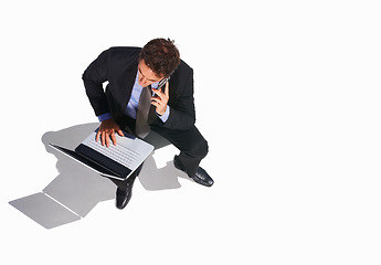 Image showing Business man, phone call and top view of laptop, listen to conversation or communication on white studio background mockup space. Computer, mobile chat and lawyer consulting, legal advice and above