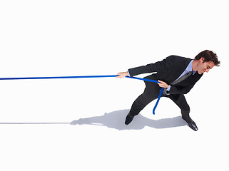 Image showing Businessman, frustrated and tug of war by white background, career challenge and industry competition. Young person, mental health and professional worker with rope, top view and job battle in studio