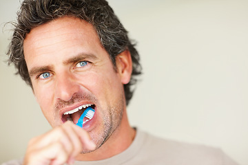 Image showing Dental, man and portrait with teeth or toothbrush for morning routine, hygiene and healthy mouth. Mature, person and pride with brush for cleaning, washing and oral health with confidence or mock up