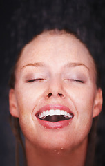 Image showing Shower, water splash and face of happy woman in a house for hygiene, fresh or stress relief closeup. Smile, bathroom and female person relax with cleaning, wellness or body care, skincare or routine