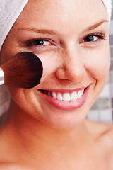 Image showing Happy, portrait and woman with makeup, brush or results in bathroom closeup for wellness. Smile, face and female person with beauty, tools or foundation, cosmetics or powder application for grooming