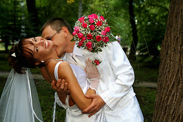 Image showing Groom kissing bride 