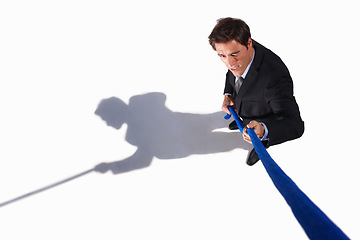 Image showing Businessman, conflict and tug of war by white background, career challenge and workplace competition. Young person, mental health and professional worker with rope, top view and job stress in studio