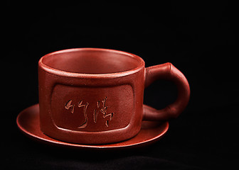 Image showing Brown cup and saucer