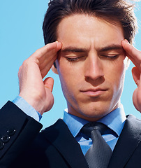 Image showing Business man, headache and frustration or burnout, mental health and stress for debt. Professional, male person and migraine or anxiety, worry and massage temple for fatigue emergency by blue sky