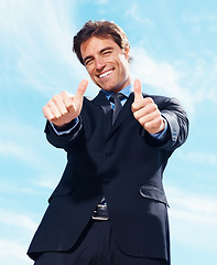 Image showing Business man, thumbs up and happy for success, support or like emoji, portrait and blue sky background in real estate. Excited realtor, corporate businessman or agent with good job, okay or yes hand