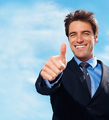 Image showing Business man, thumbs up and portrait for success, support or like emoji on blue sky background for real estate. Face of professional realtor, corporate businessman or agent for good job, okay or yes