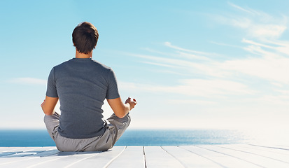 Image showing Relax person, blue sky and yoga meditation for spiritual peace, freedom or healing zen soul, aura or chakra energy balance. Mockup space, sunshine and back of mindfulness yogi on nature beach patio