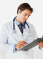 Image showing Man, doctor and writing on clipboard for prescription, appointment or checklist against a white studio background. Male person, surgeon or medical professional smile with notes or life insurance