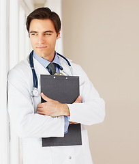 Image showing Man, doctor and thinking by window at hospital with clipboard for prescription, research or medical historyl. Male person or surgeon in wonder for diagnosis, appointment or life insurance at clinic