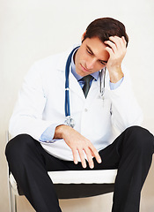 Image showing Burnout, mental health and sad doctor, man or surgeon depressed over medical mistake, wellness services crisis or disaster. Hospital risk, cardiology fail and tired from clinic healthcare work