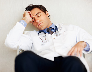 Image showing Burnout, tired doctor and sleeping man, health expert or exhausted surgeon dream, rest or nap after cardiology services. Eyes closed, relax medical GP and nurse fatigue in clinic healthcare hospital