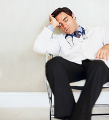 Image showing Burnout, fatigue and sleeping doctor, man or surgeon rest after medical cardiology, wellness services or exhausted. Eyes closed, relax medic and professional nurse tired in clinic healthcare hospital