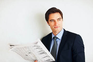 Image showing Business man, reading newspaper and wall for thinking, idea or economy to check stats on global market. Trader, investor or happy for revenue announcement in morning for stock, decision and finance