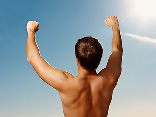 Image showing Back, hands raised and a shirtless man on a blue sky with flare for fresh air in summer during vacation. Freedom, fitness and winner with the body of a strong, healthy person outdoor for wellness