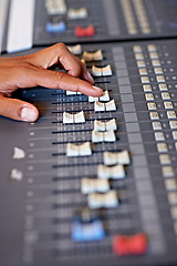 Image showing Hand, mixing and sound board in recording studio with dj, technology and media on desk. Music, deck and person editing with equipment for audio, production and moving switch on console for radio song
