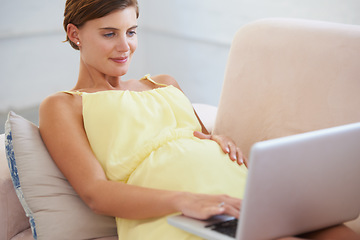 Image showing Relax, pregnant and woman on laptop in house living room for childcare website, information or reading email. Happy, mother or person on home sofa with technology, research and pregnancy health blog