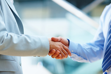 Image showing Business people, shaking hands and welcome to meeting, partnership and introduction for deal at law firm in lobby. Closeup of corporate lawyer or clients handshake for success, support and consulting