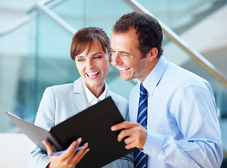 Image showing Business people, reading folder and teamwork, planning budget or advice for financial report in lobby. Corporate manager, clients or woman for bookkeeping questions, documents or auditor with support