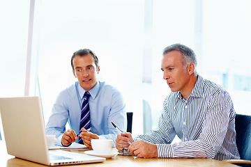 Image showing Business men, planning and teamwork on a laptop for advice, support and strategy in a financial meeting. Professional manager, mature boss or people talking of revenue, sales or profit on a computer