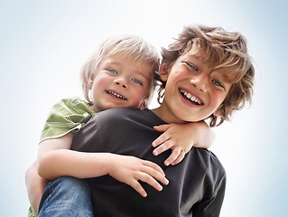 Image showing Siblings, boy and brother or portrait with piggyback for bonding, relationship and freedom with blue sky. Family, male person or kids with play, care and love for happy, peace or support in nature