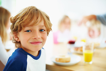 Image showing Kid, breakfast and portrait at home in the morning with food, smile and happy from eating. Family, dinner table and hungry young child with meal for health and nutrition in a house with juice